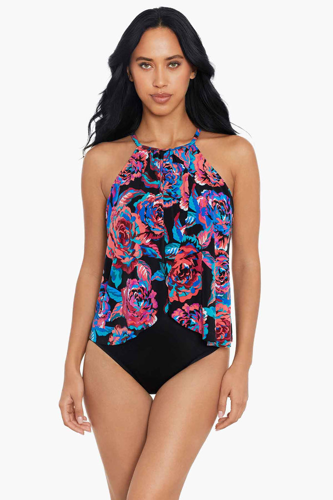 Woman wearing a high neck one piece swim suit.