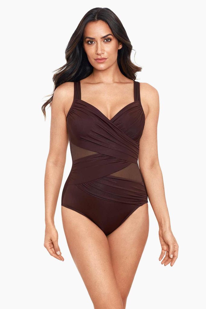 Woman in a slimming one piece swim suit.