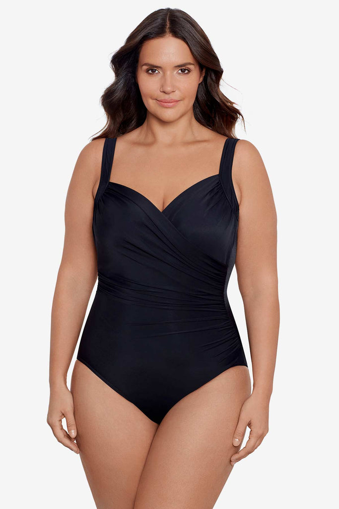 Young woman wearing a one piece swim suit.
