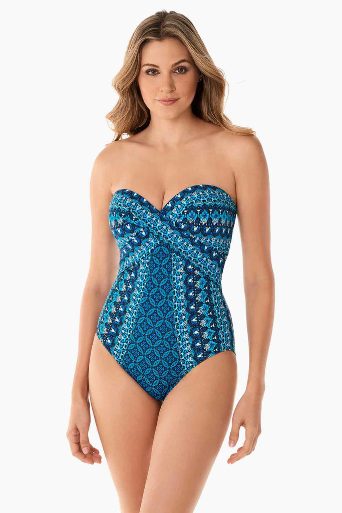 Woman in a stylish bandeau swim suit.