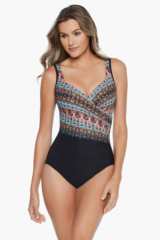 Girl in a printed one piece swim suit.