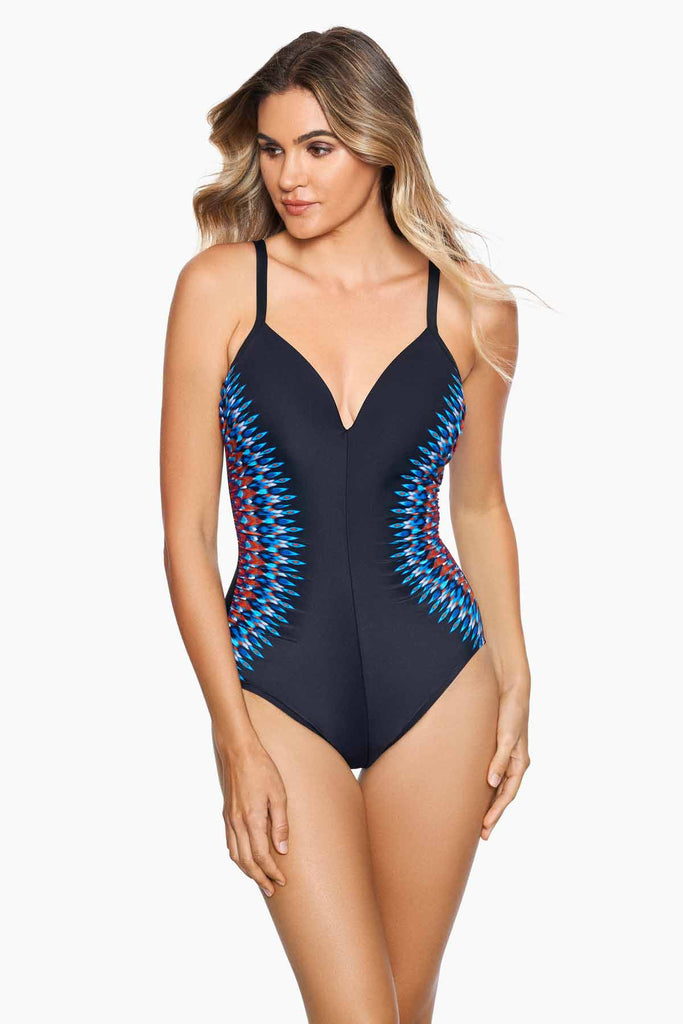 Woman wearing a nepali temptation one piece swim suit.