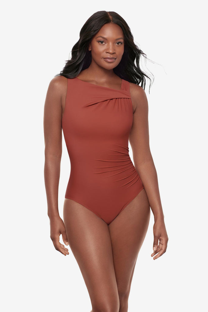 Woman wearing a brown high neck one-piece swimsuit