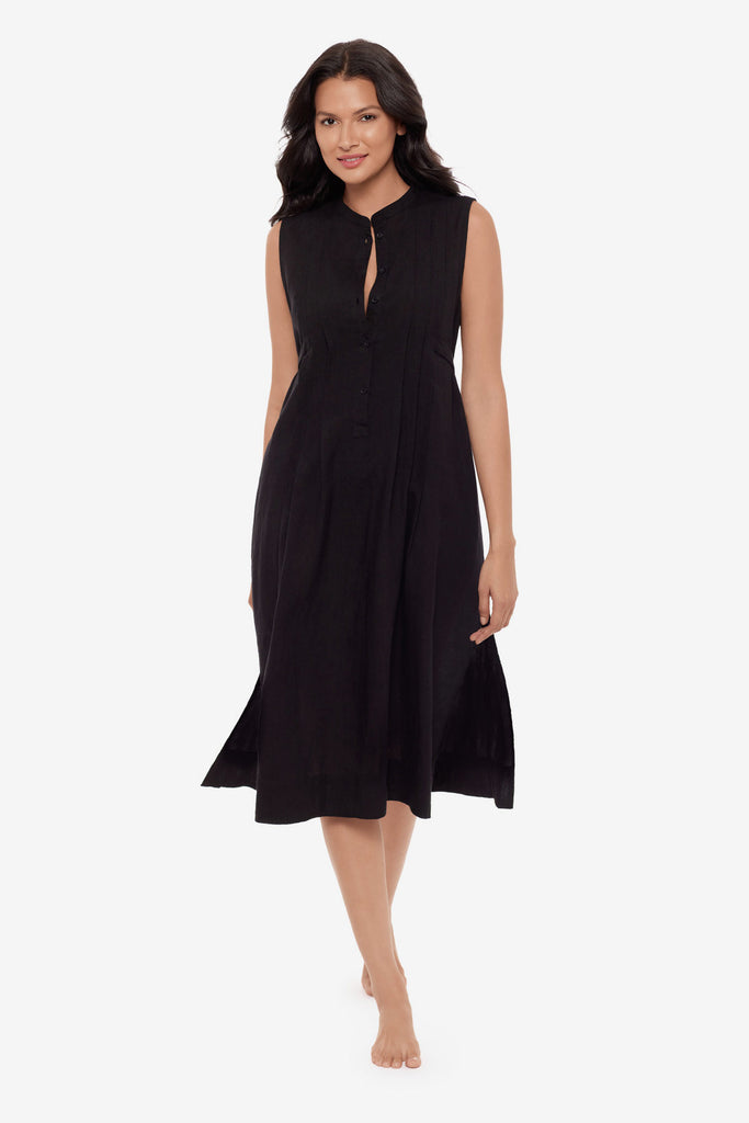 Woman wearing a black swim dress cover up