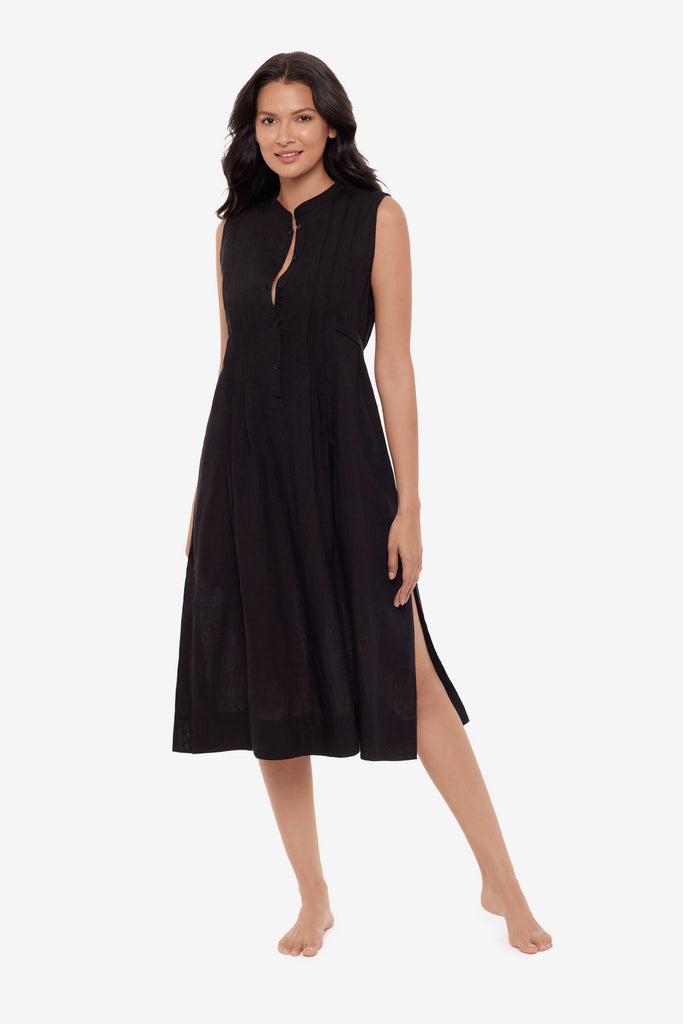 Woman wearing a black swim dress cover up