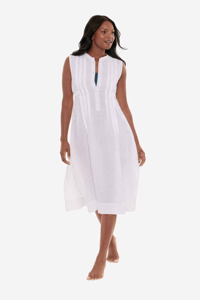 Woman wearing a white swim dress cover up