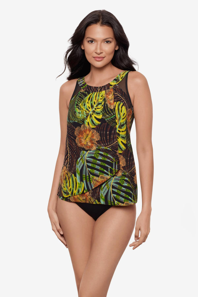 Woman wearing a multicolored palm leaf printed tankini top