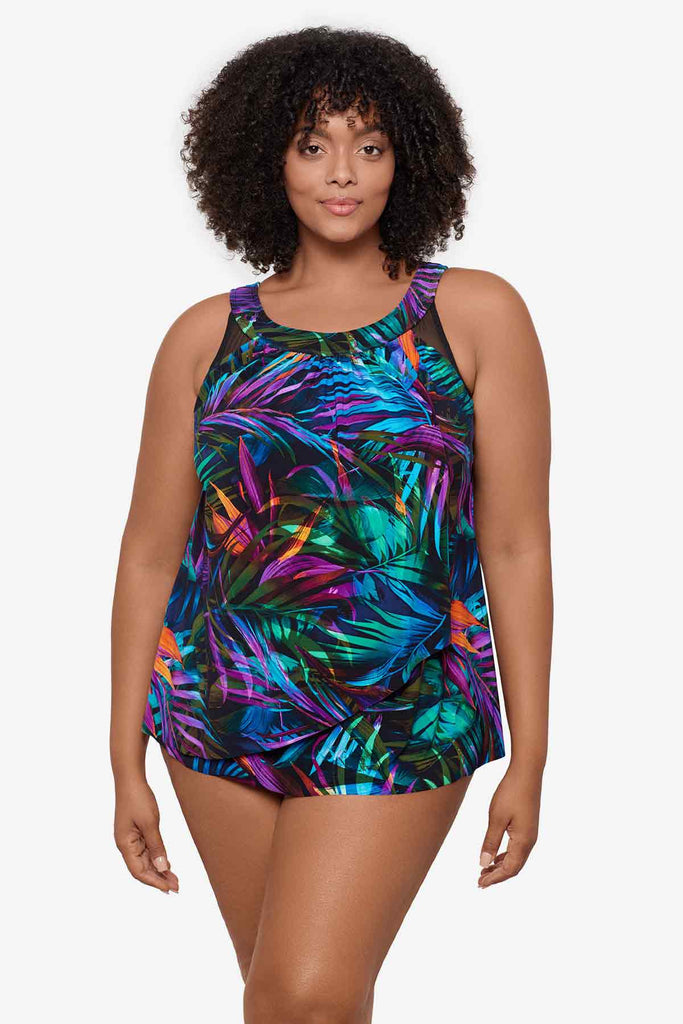 Woman wearing a multicolor tankini top with neon palm leaves