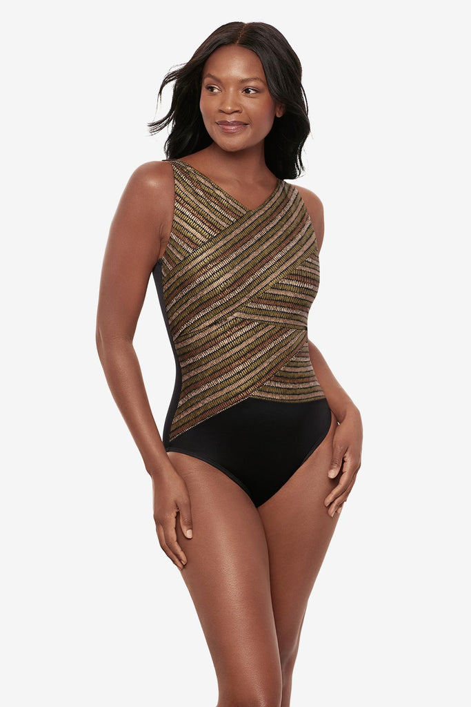 Woman wearing a shimmery golden brown high neck one-piece swimsuit