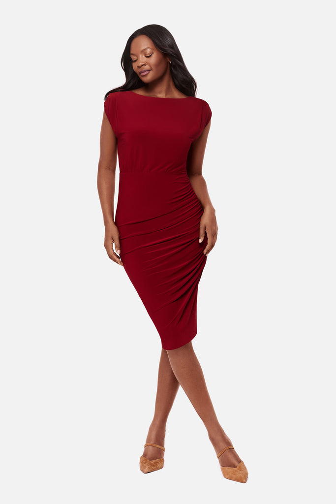 Woman wearing a bright red dress with a high neckline