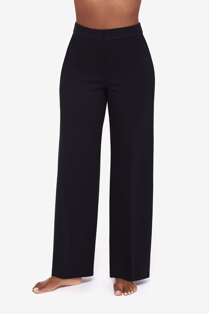 Close up of Woman's legs in black wide legs pants