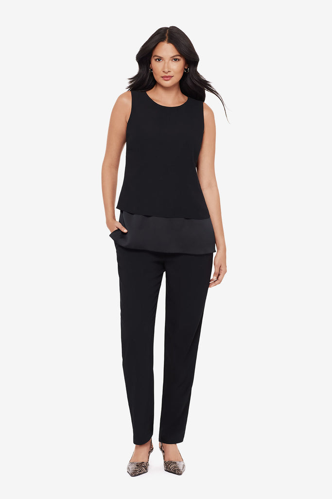 Woman wearing a black layered tunic top with matching jogger pants