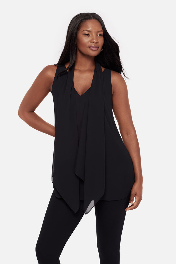 Close up of woman wearing a black layered tunic blouse