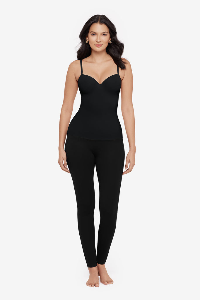 Woman wearing a black cup bra cami top with matching black leggings