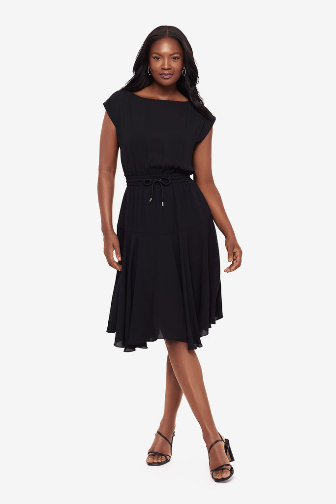 Woman wearing a black short sleeve dress with a drawstring detail