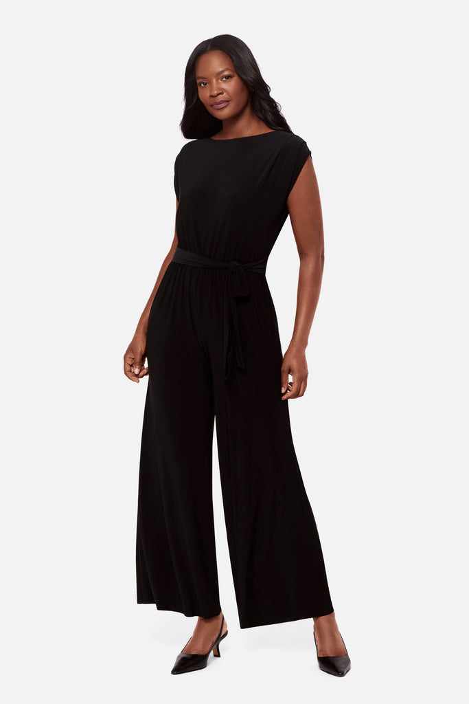 Woman wearing a black short sleeve romper