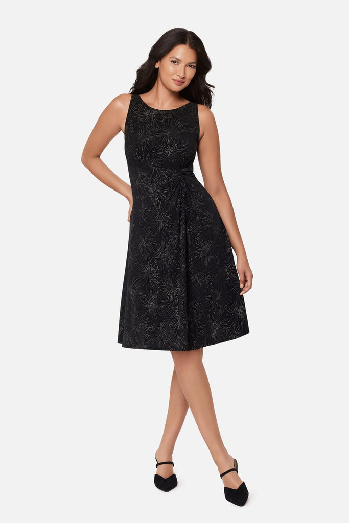 Woman wearing a black sparkle printed knee length dress
