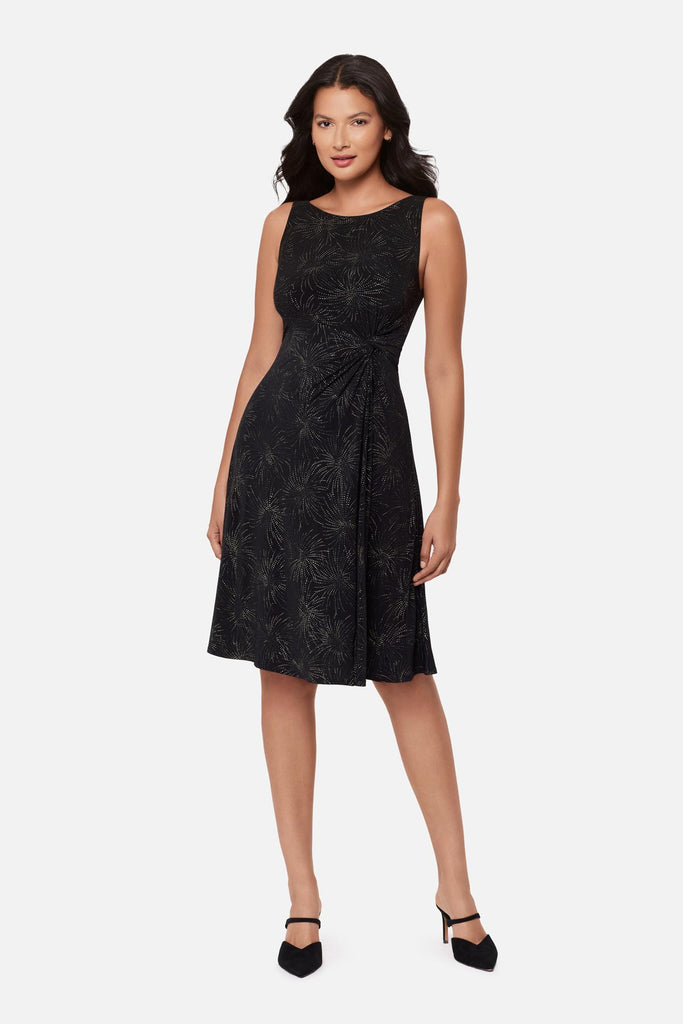 Woman wearing a black sparkle printed knee length dress