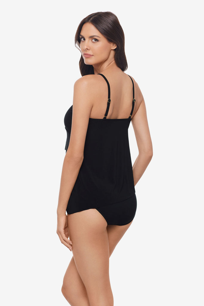 Woman faced left wearing a black layered tankini top