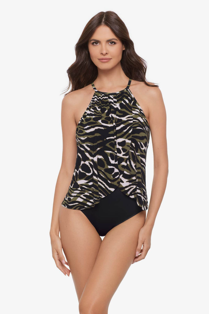 Woman wearing a multicolored animal print one-piece swimsuit