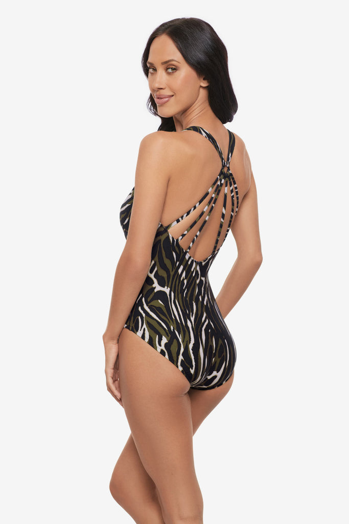Woman turned left wearing a multicolored animal print one-piece swimsuit