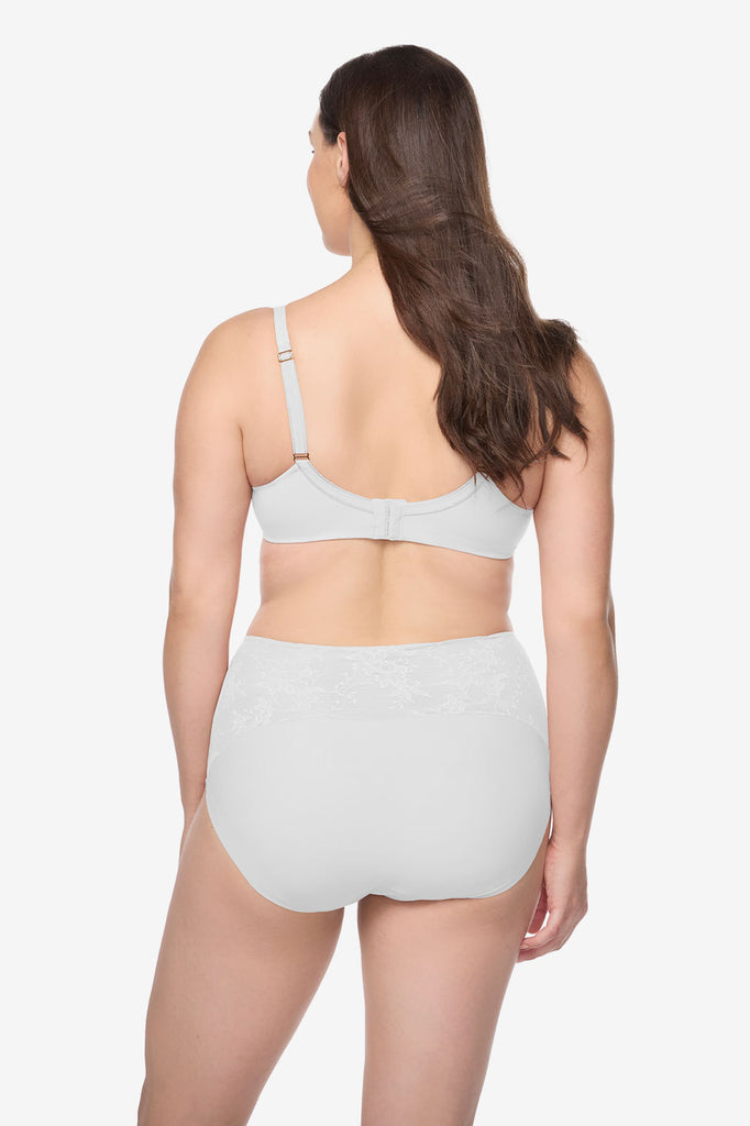 Woman turned away wearing a white bra and high waisted underwear set