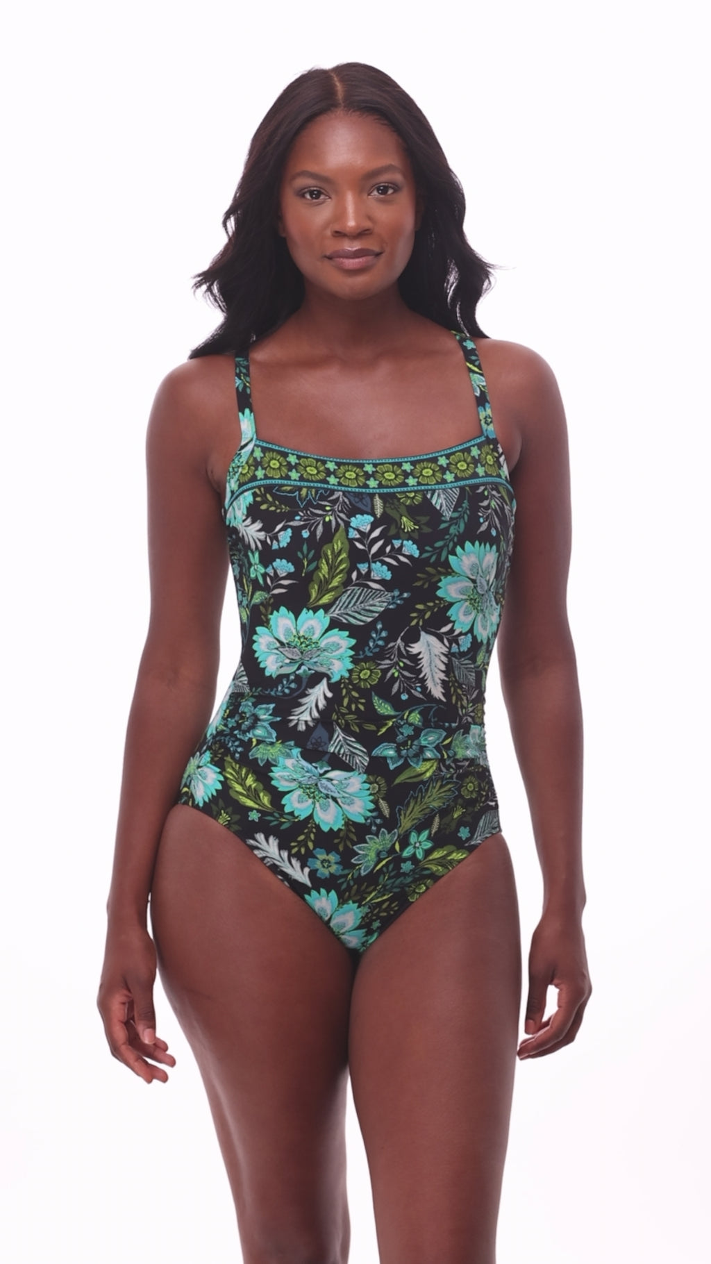 Woman wearing a multicolored floral printed one-piece swimsuit