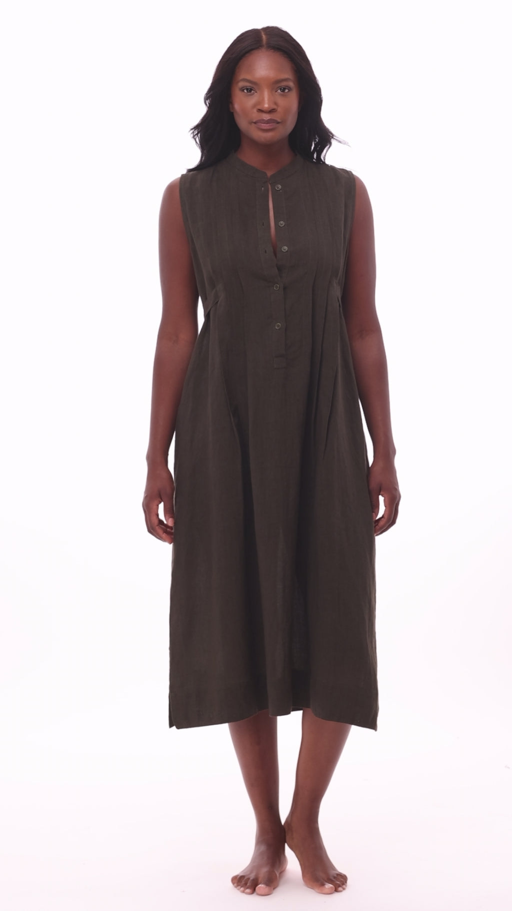 Woman wearing a dark green swim dress cover up