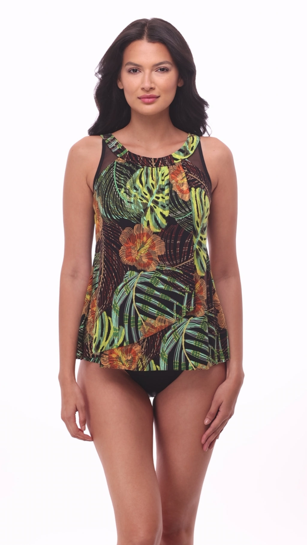 Woman wearing a multicolored palm leaf printed tankini top