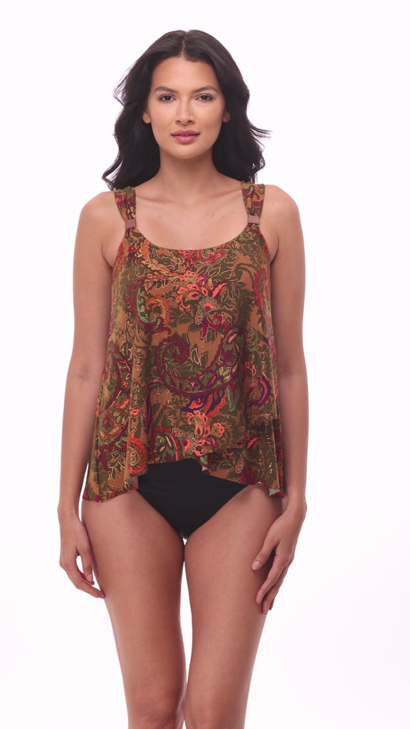 Woman wearing a multicolored paisley printed tankini top with details on the straps