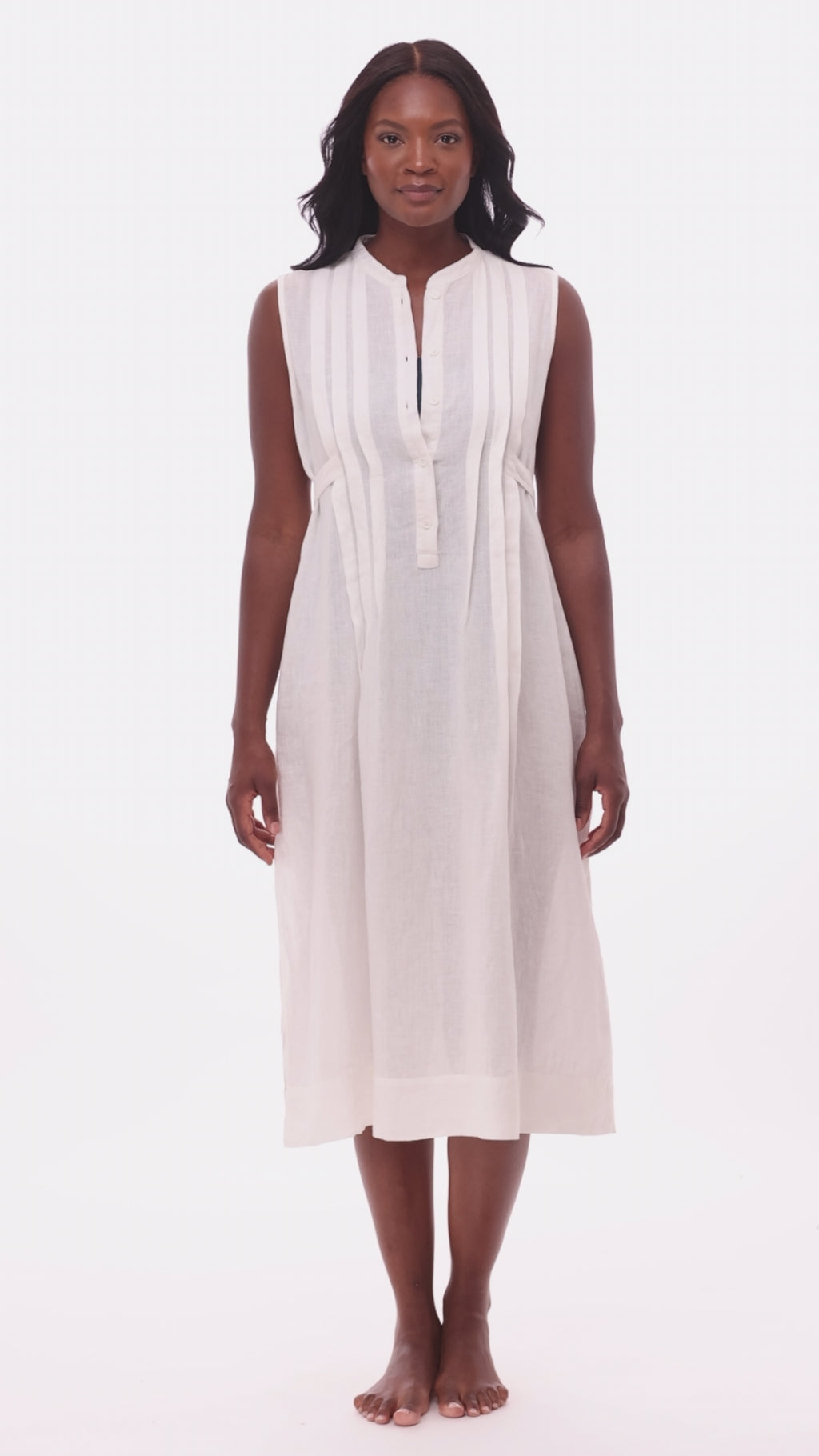 Woman wearing a white swim dress cover up