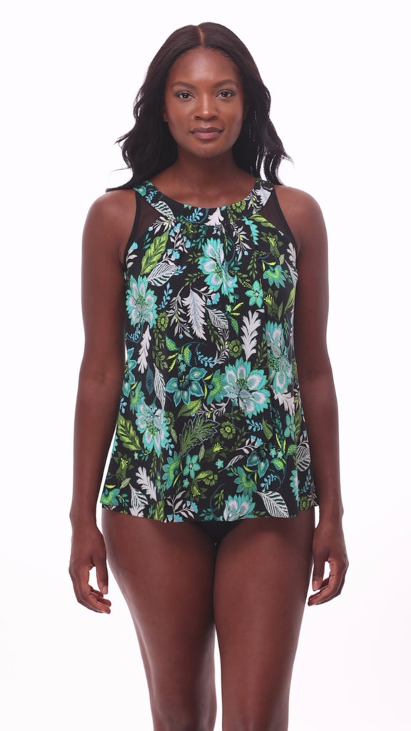 Woman wearing a multicolored floral printed tankini top