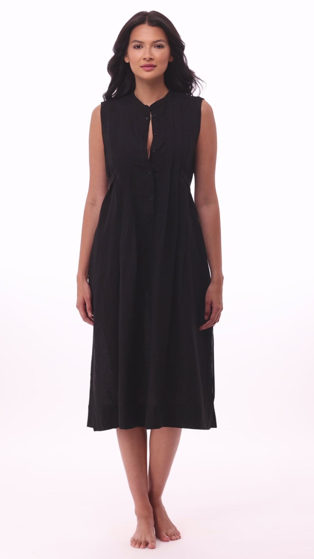 Woman wearing a black swim dress cover up