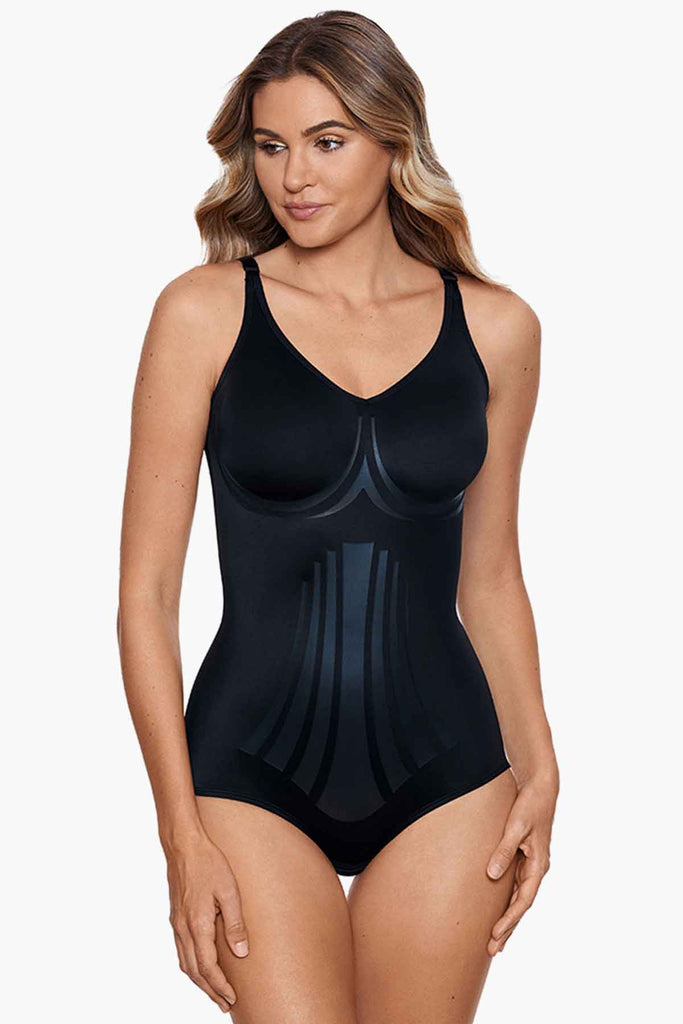 Woman in a miracle suit body briefer.