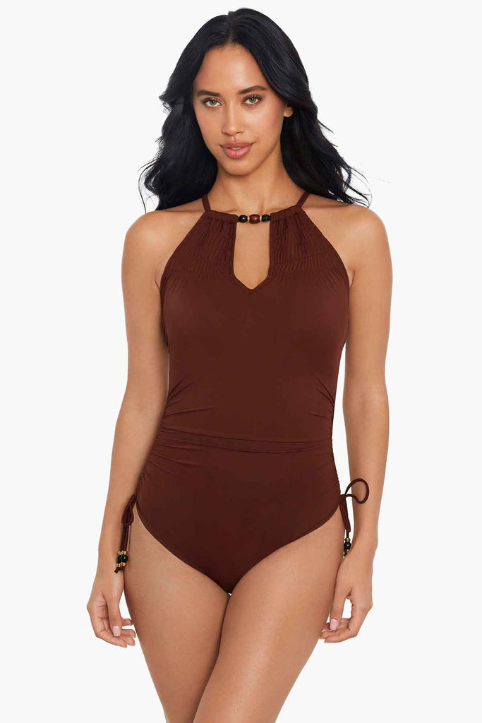 Woman in a one piece swim dress.