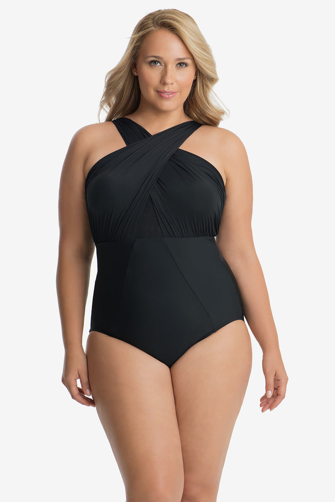 Girl wearing a plus size one piece swim suit.