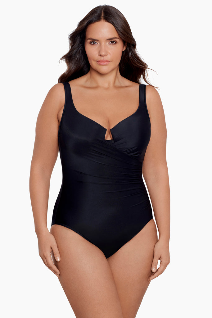 Woman in a plus size one piece swim suit.