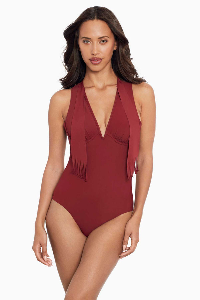 Woman in a amoressa one piece swim suit.