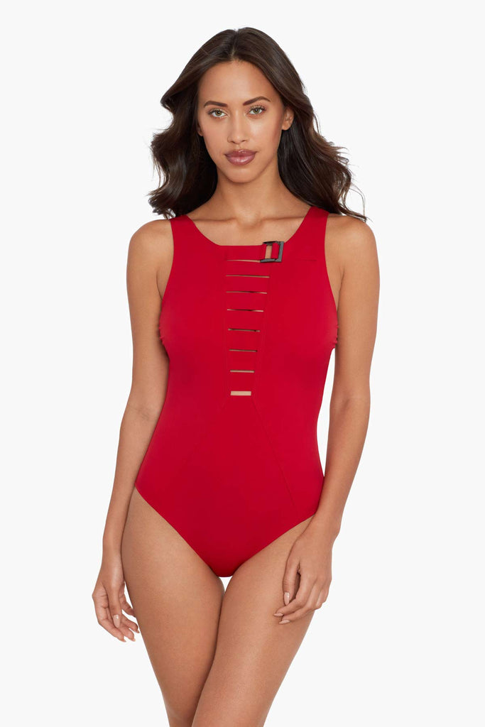 Womanlooking hot in a one piece swim suit.
