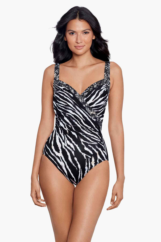 Slim woman in a miracle suit one piece.