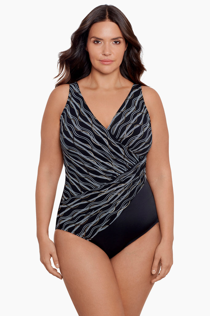 Woman in a plus size one piece swim suit.